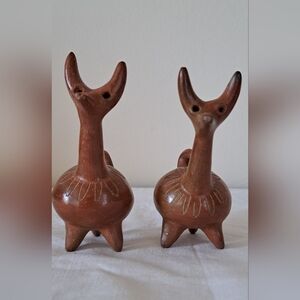 2 hand crafted pottery dogs.